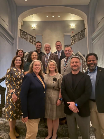 A group of people posing for a photoAI-generated content may be incorrect.