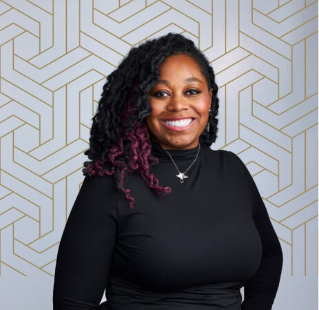 A person smiling at cameraAI-generated content may be incorrect.