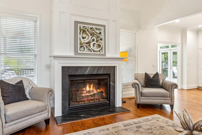 A fireplace in a living roomAI-generated content may be incorrect.