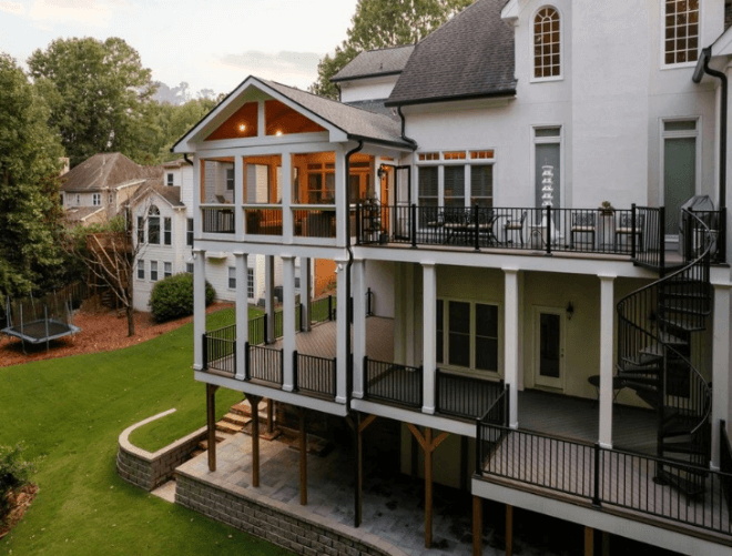 A large house with a large deck and a lawnAI-generated content may be incorrect.