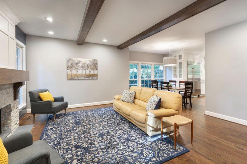 A living room with a couch and a rug