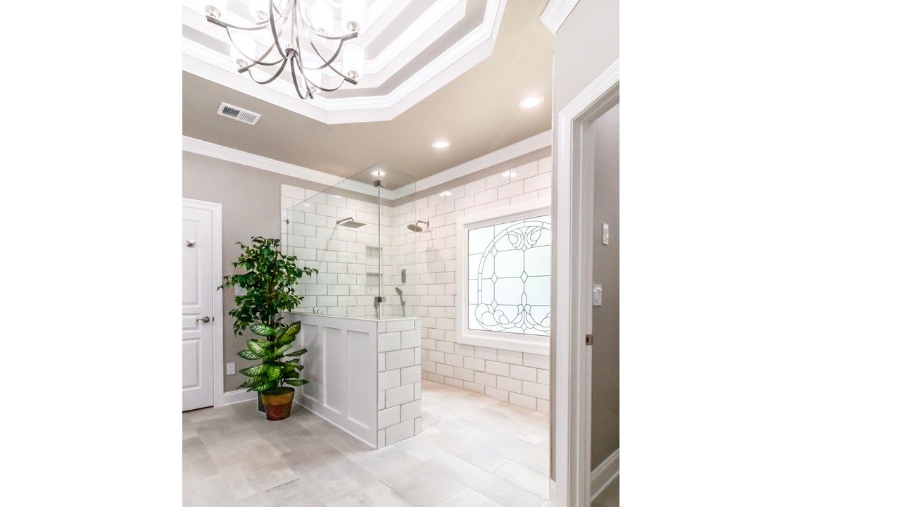 Large curbless shower, electronic controls for multiple fixtures, heated tile floor