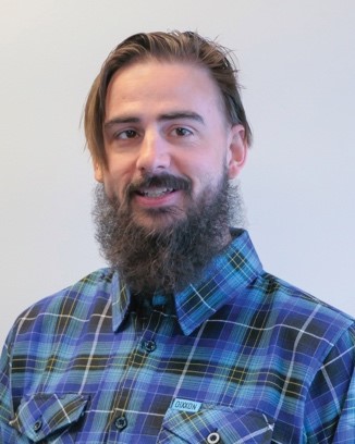 A person with a beardDescription automatically generated