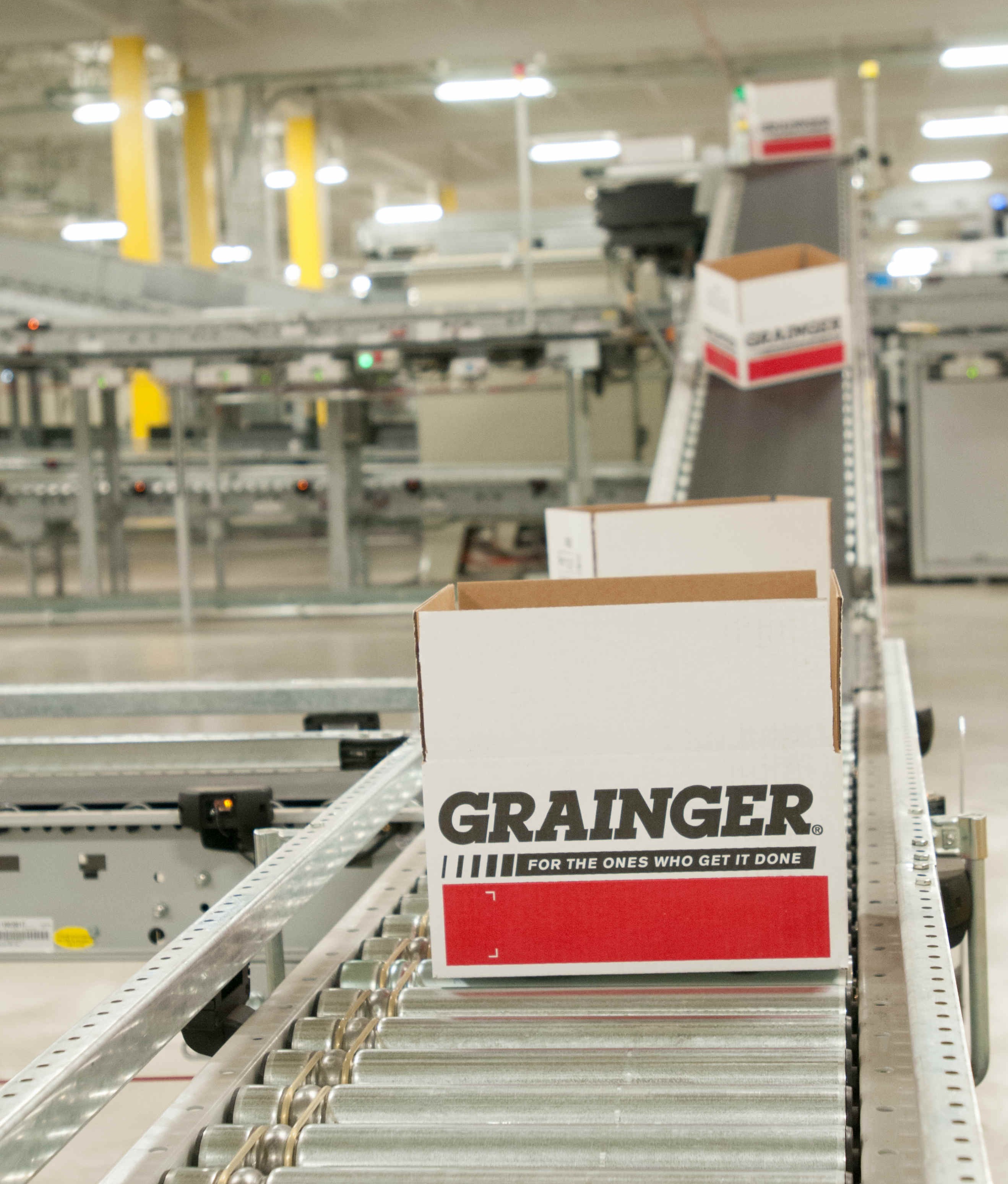 grainger boxes on conveyor in warehouse