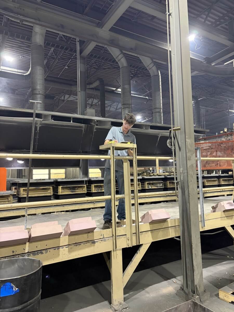 Nathan Alfieri working at a station on the Erie Bronze & Aluminum foundry floor
