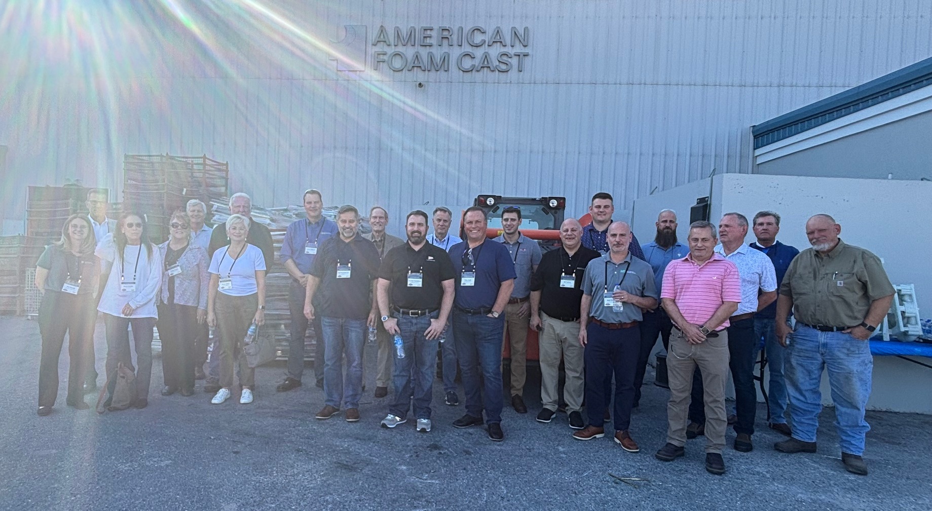 tour attendees in front of American Foam Cast building