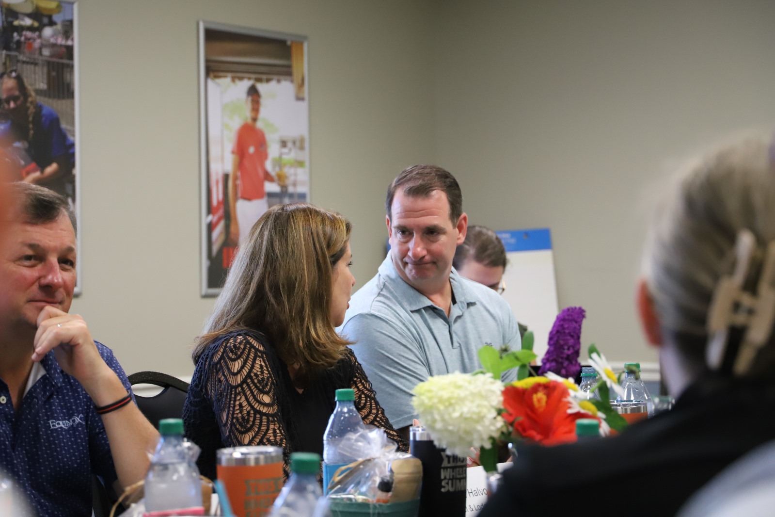 Members discuss topics at a board and legislative meeting