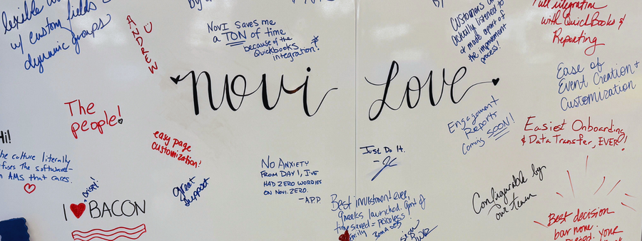 Whiteboard with notes from customers about how much they love Novi AMS