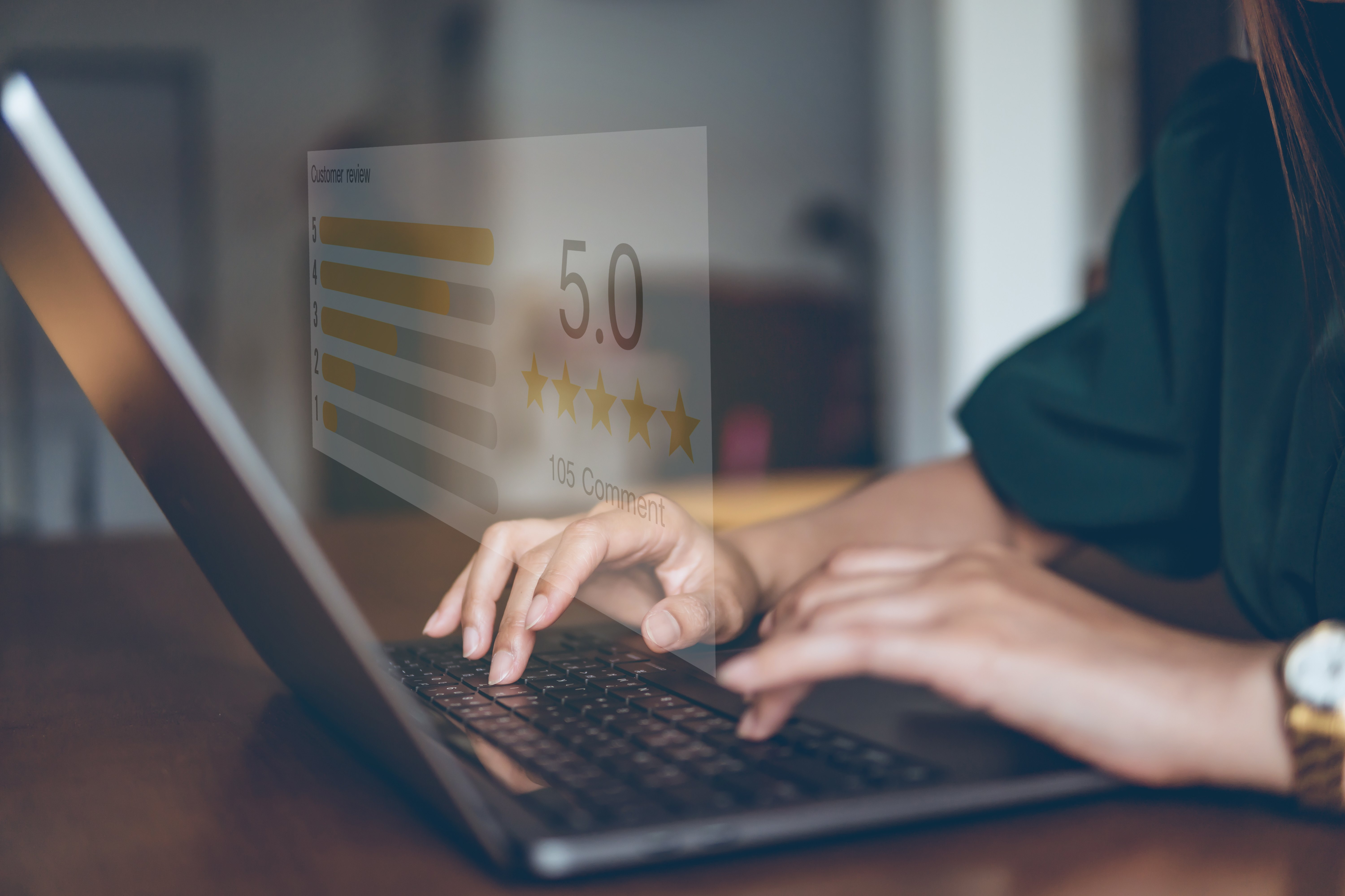 a therapy client types on a laptop. An overlaid graphic shows a 5 star review.