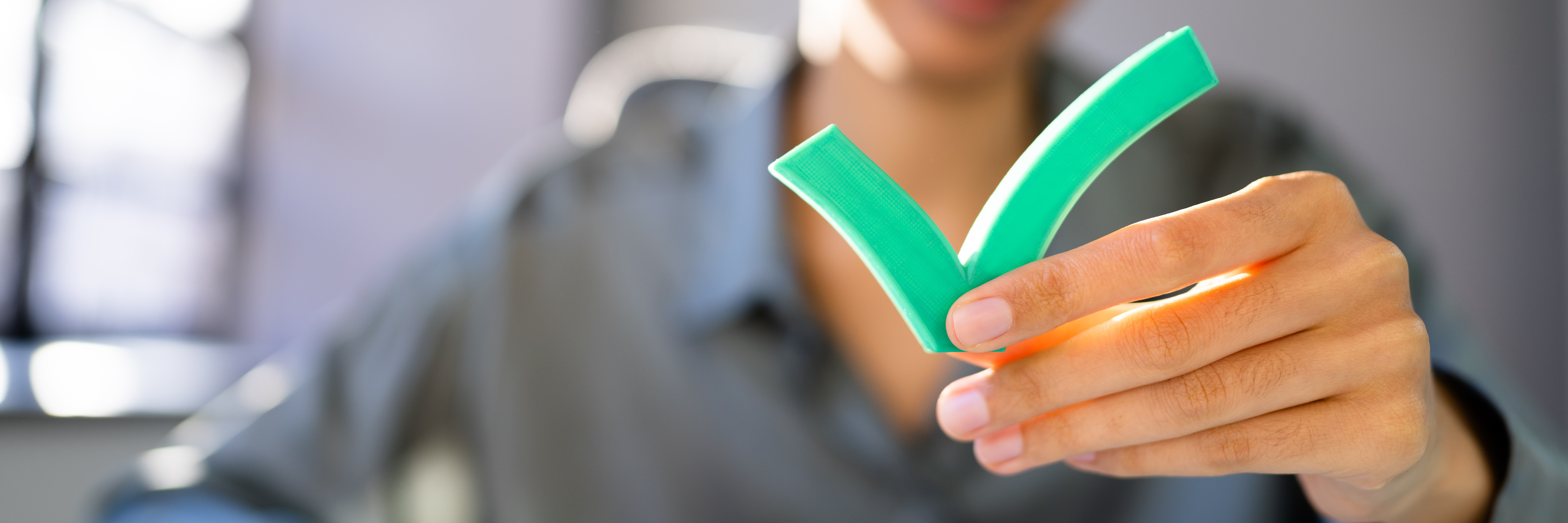 A therapist holds a green check mark.