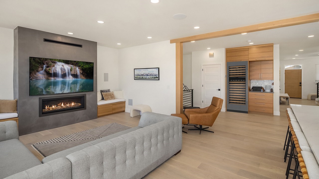 Whole home remodel in Issaquah, WA with open living room and wine wall by Higgason Homes