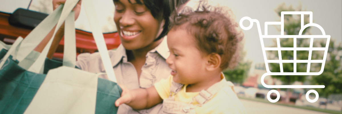 A mother and child unload a bag of groceries from their car