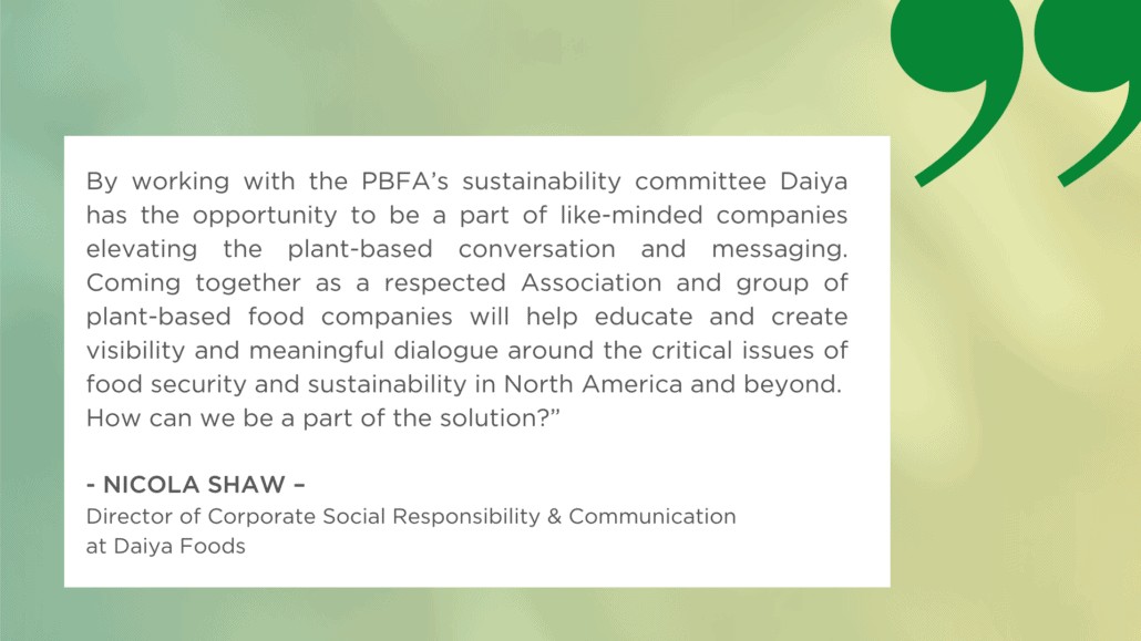 A text graphic featuring a testimonial quote from Nicola Shaw, Director of Corporate Social Responsibility & Communication at Daiya Foods, sharing insights on food security and sustainability dialogue. The white text box sits on a faded green background decorated with a large dark green quotation mark in the top right corner.