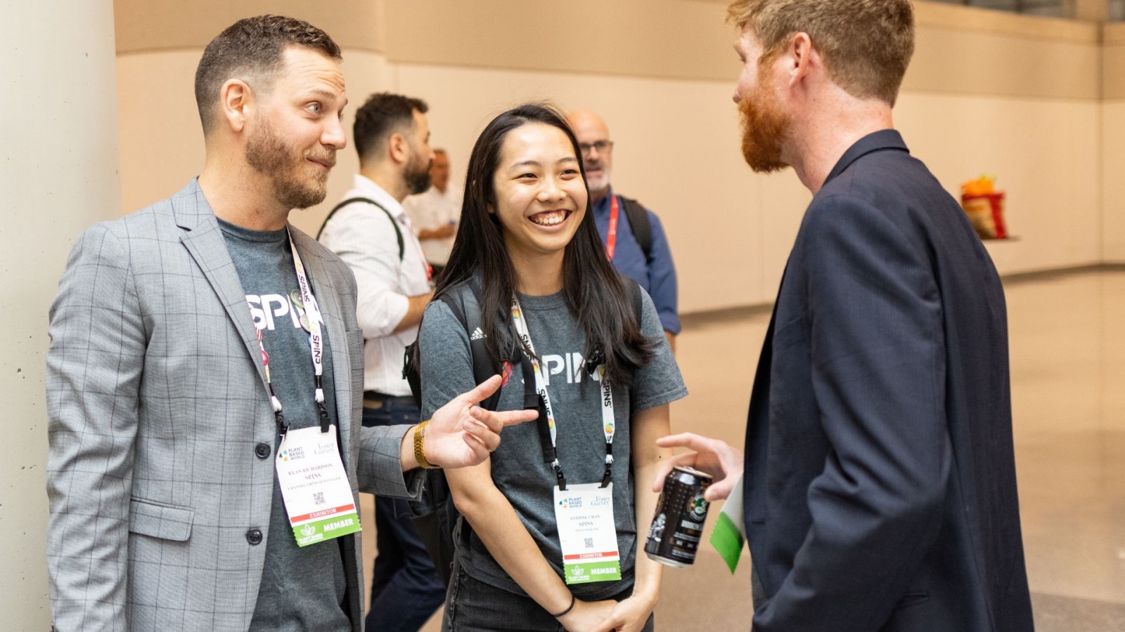 Industry service providers chatting a tradeshow for the plant-based foods industry