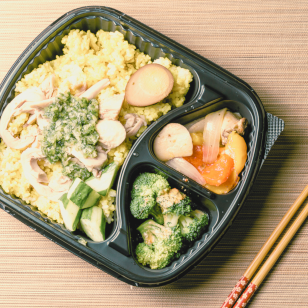A plant-based prepared meal in a tray.