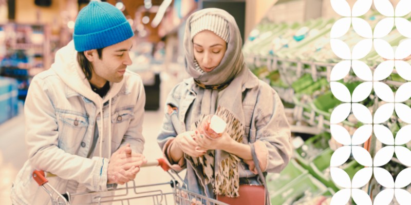 Two people shopping in a grocery store