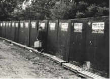 black and white photo of Port-O-San units at Woodstock