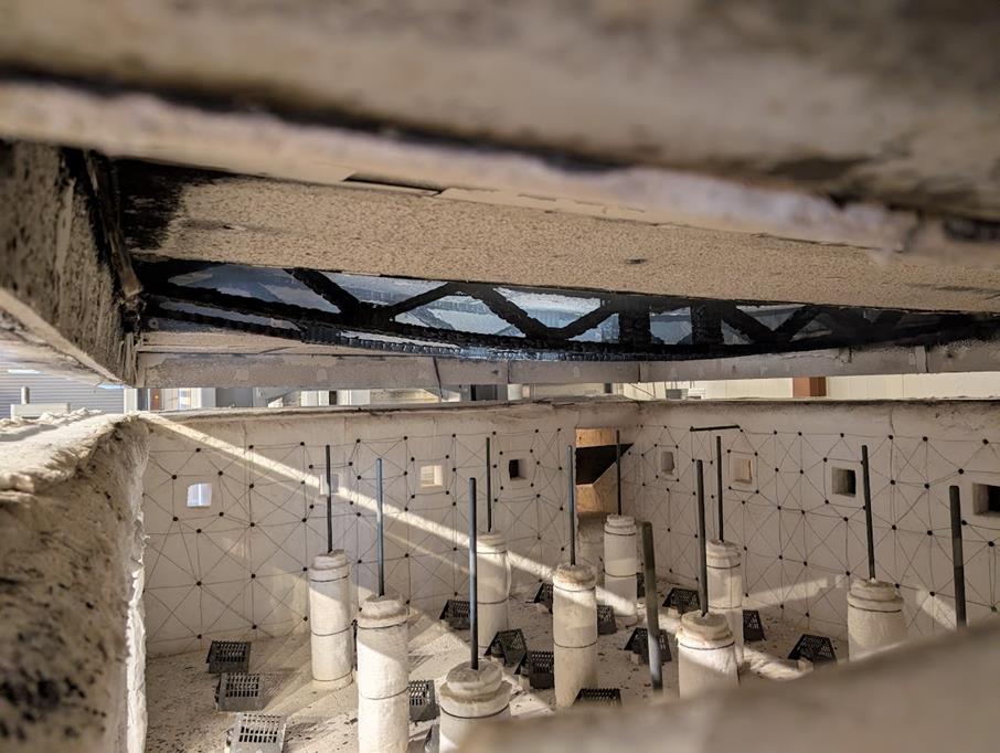 Charred EFP truss viewed from below inside the test furnace