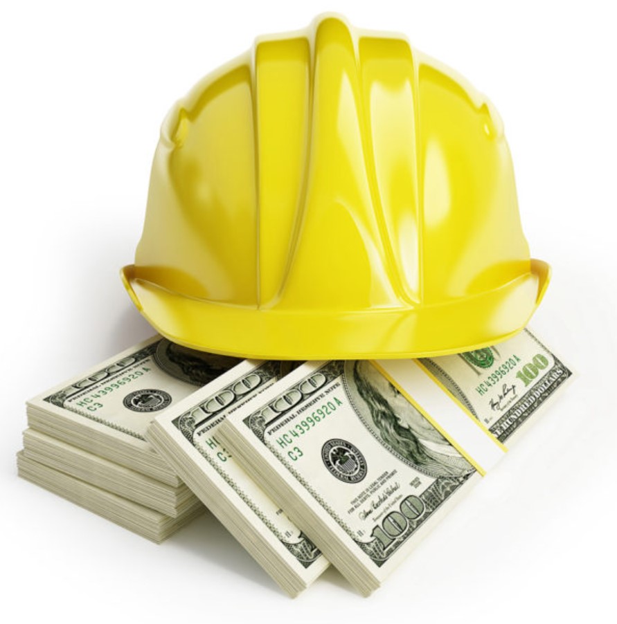 Hard hat on stack of cash