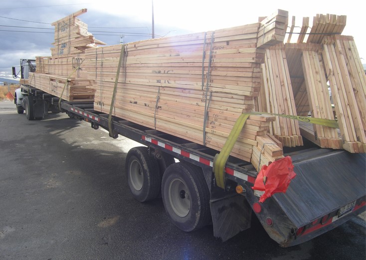 Truck loaded with trusses