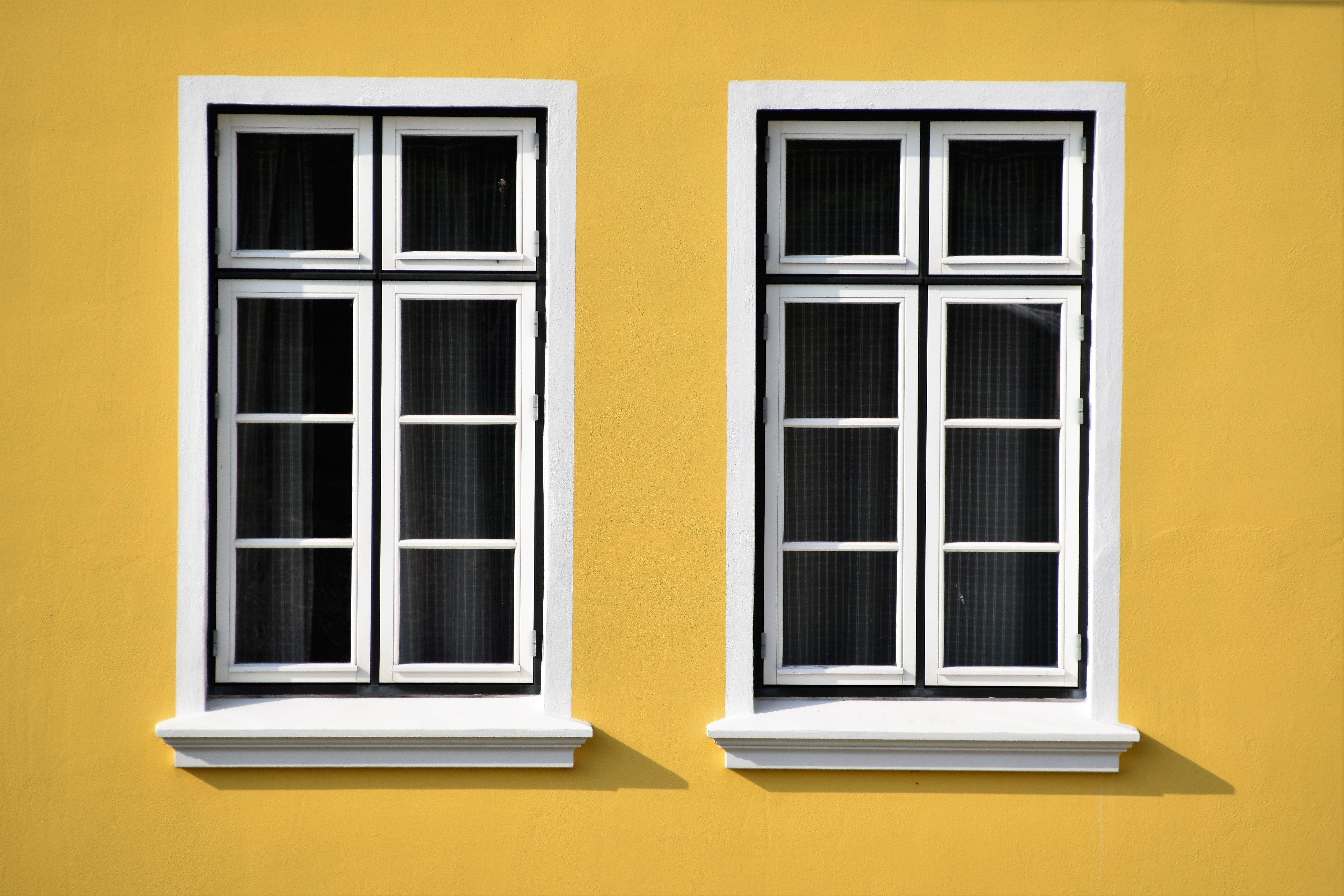 Yellow House with Energy-Efficient Windows