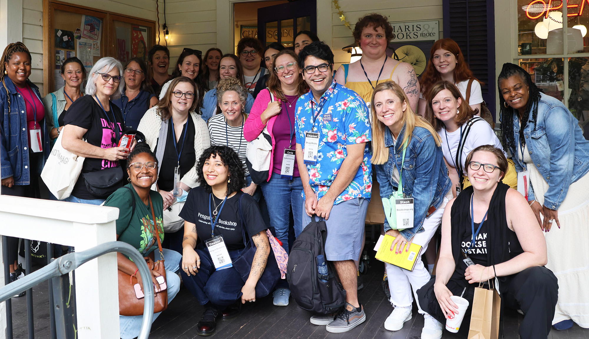 SIBA and NAIBA booksellers posing in a group before Charis Books and More during the 2025 New Voices New Rooms conference.