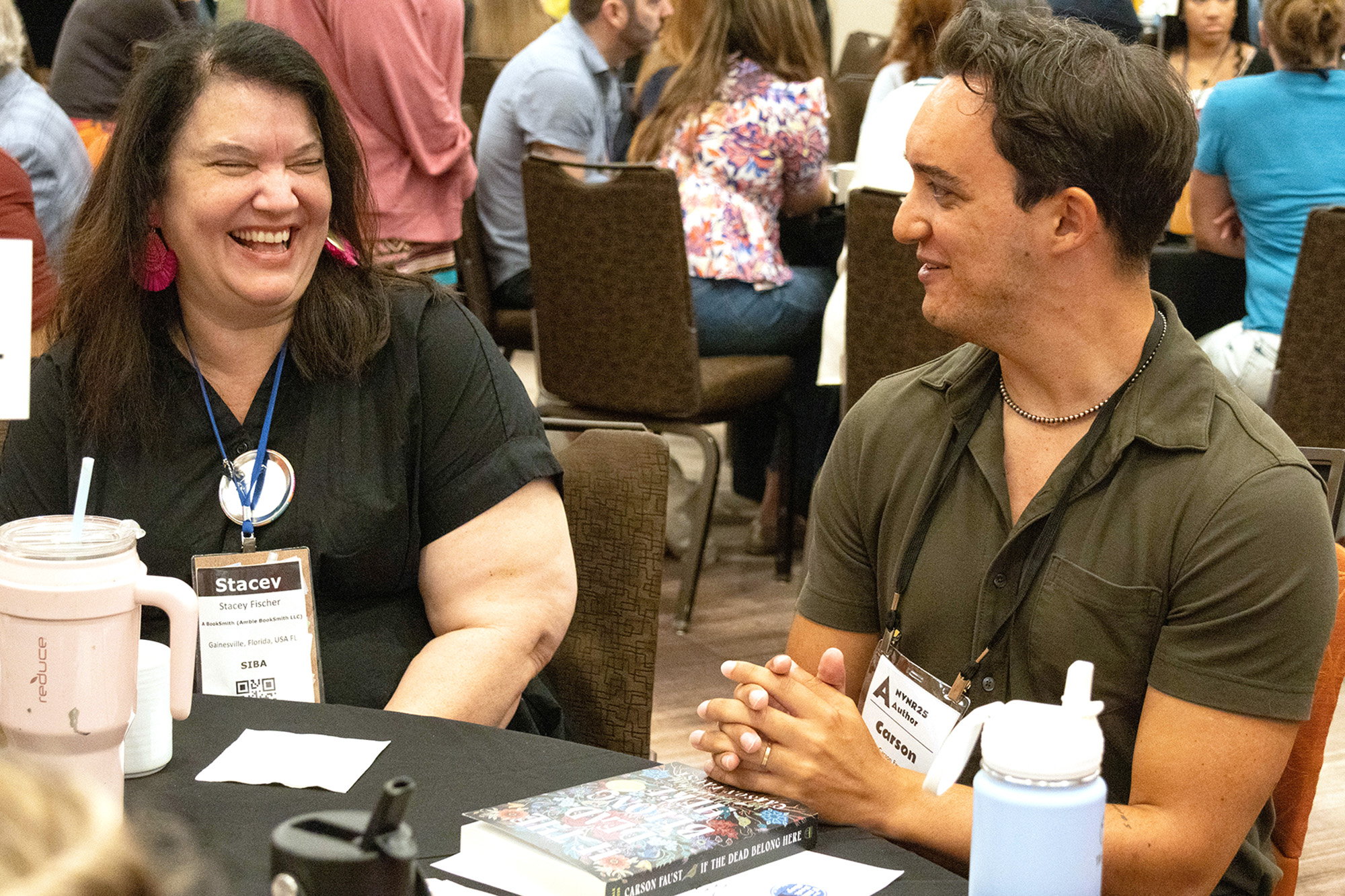 A SIBA bookseller and an author at the 2025 NVNR MoveableFeast Author event