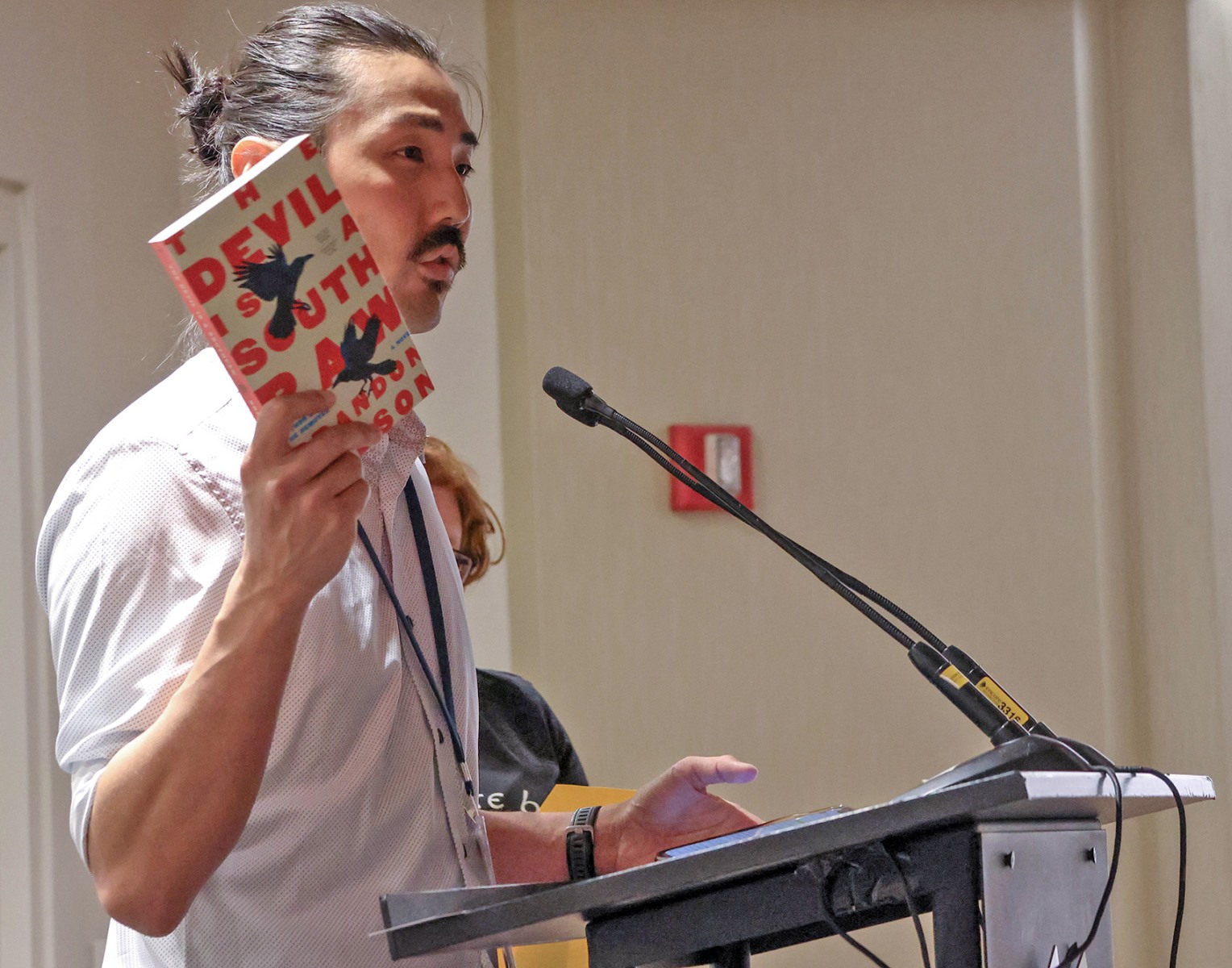 Editor announcing a new title at a Pick of the Lists session during NVNR 25