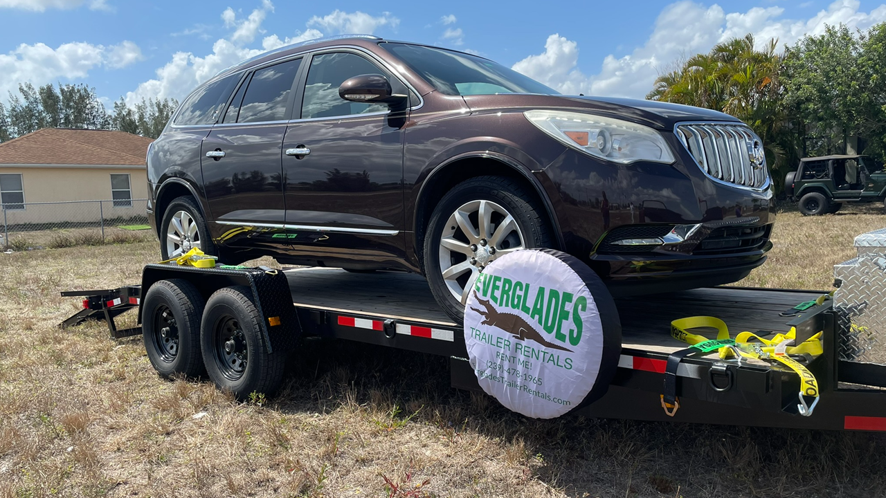 7x20 14K with a 2015 Buick Enclave loaded on it