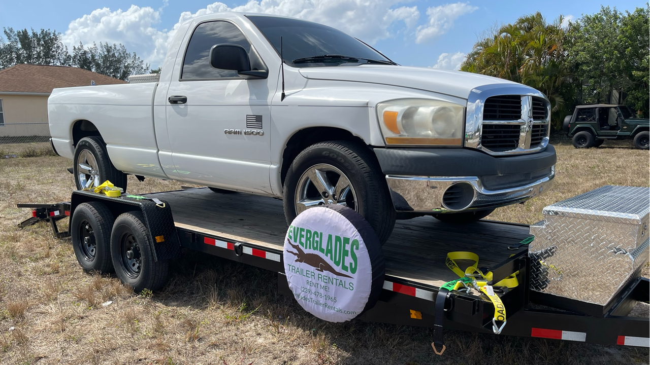 7x20 14K with a 2006 Dodge Ram 1500 Long Bed loaded on it