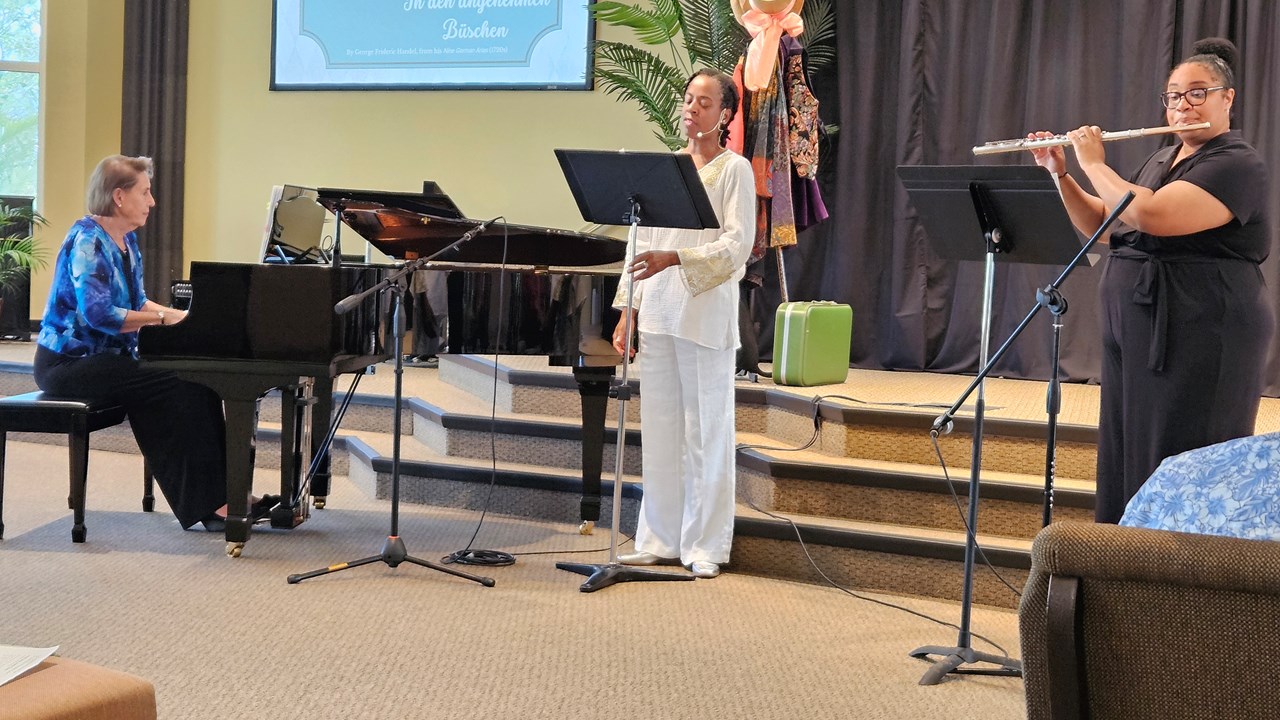 Dr. April, soprano (center), with Joanne Hartley, piano, and Darbi Lamrani, flute