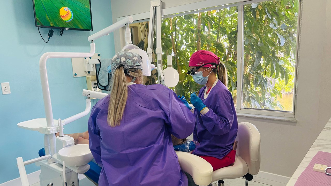 Dental care team providing treatment at Dental Blush Cape Coral
