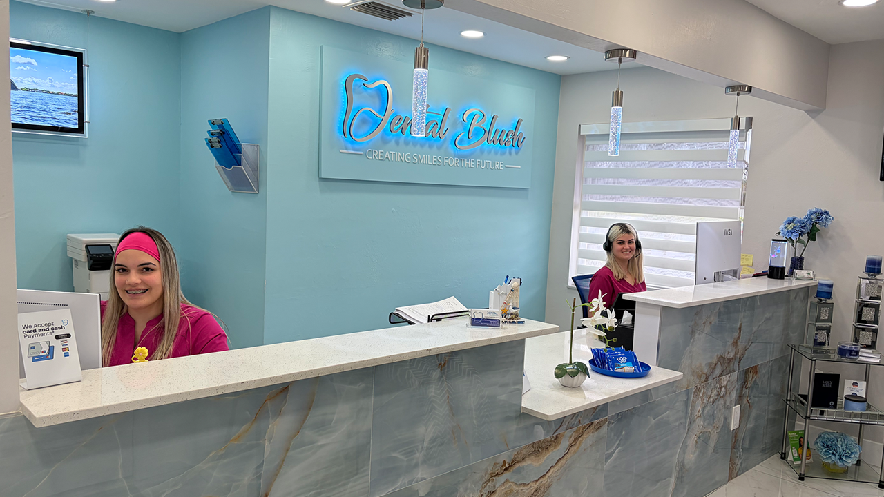 Dental Blush Cape Coral reception area with team members and office signage