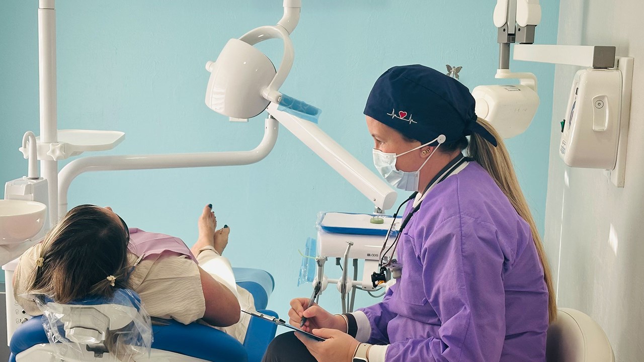 Dental professional caring for a patient at Dental Blush Cape Coral