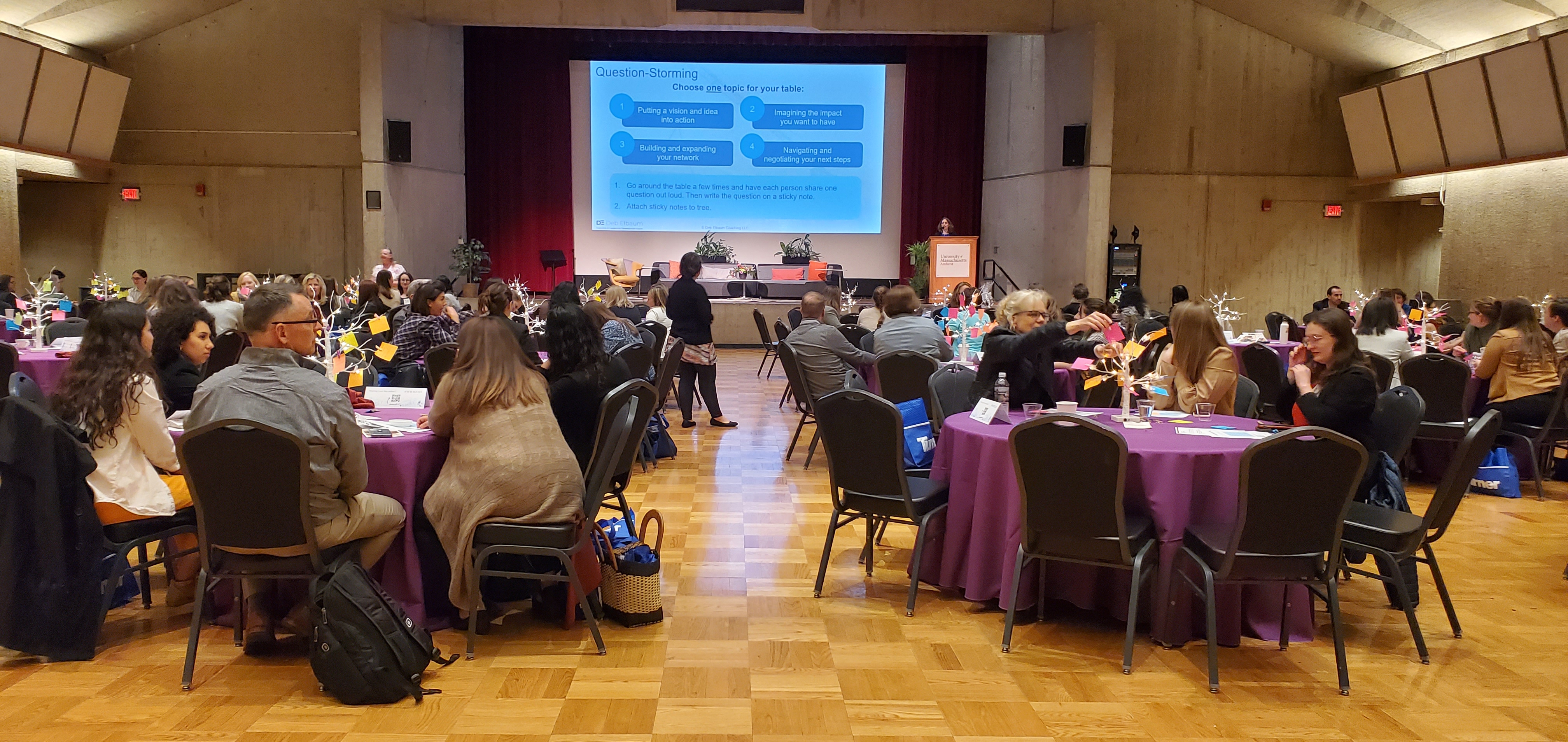 people working together a round tables in a conference