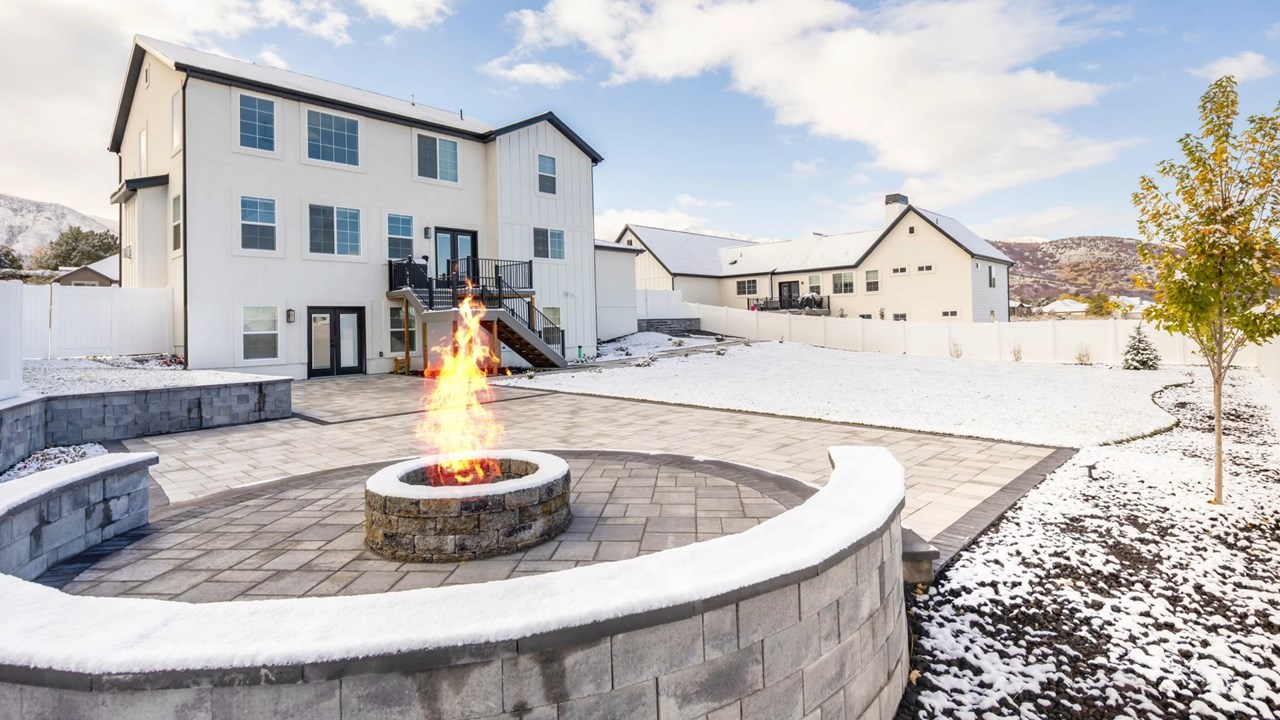 Outdoor Patio with fire pit, seating area, retaining walls and water-wise areas