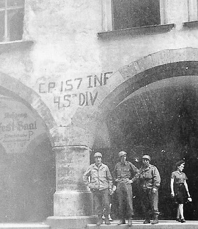 A group of people standing in front of a buildingAI-generated content may be incorrect.