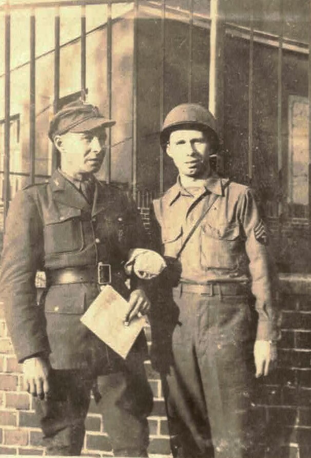 A couple of men in military uniformsAI-generated content may be incorrect.