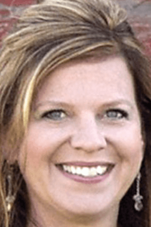 A person smiling for the cameraAI-generated content may be incorrect.