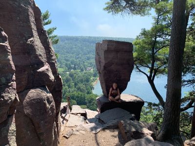 Summer intern enjoying a much-needed break in the shade along Balanced Rock.