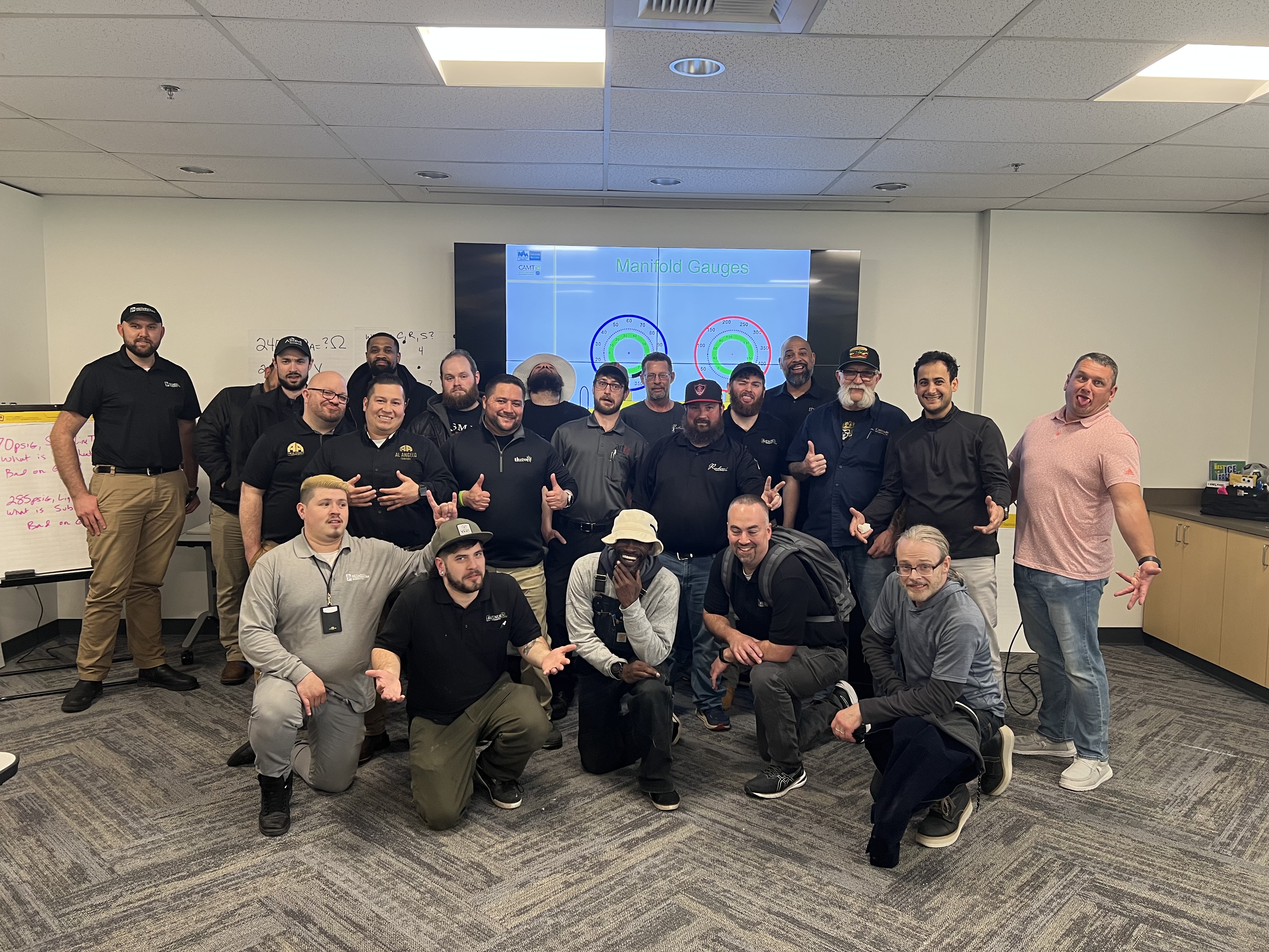 Patrick Moss (center of the front row) with his CAMT class