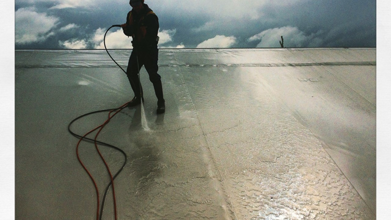 Rinsing down a 10 story high Thermostat roof lining.