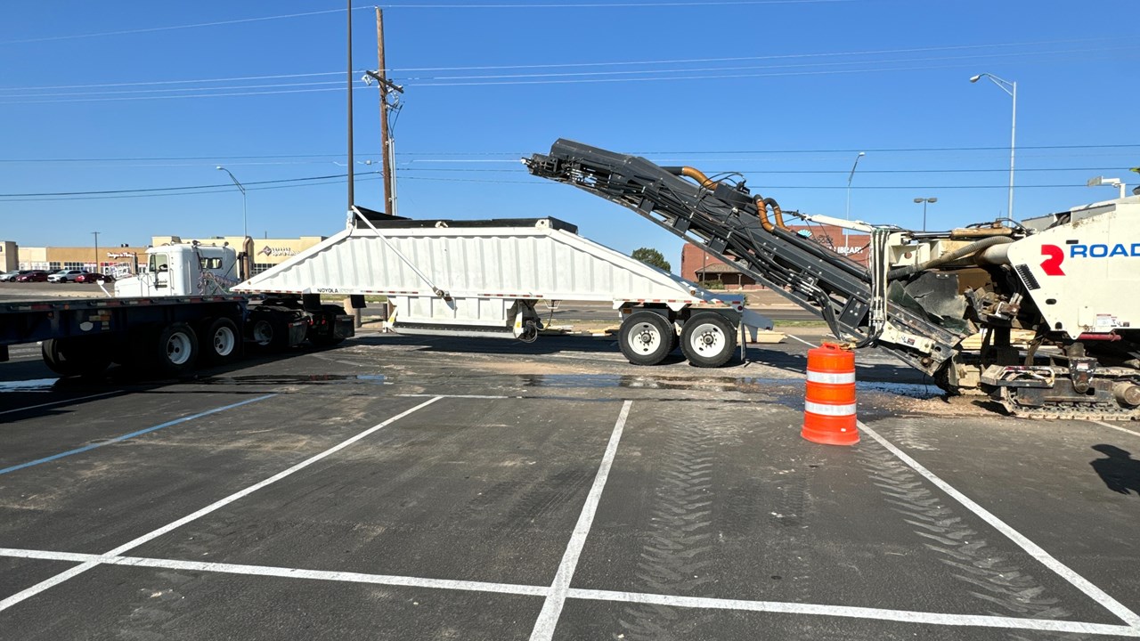Milling and paving a large parking lot in Abilene TX.